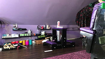 Dominatrix waxing man;s legs