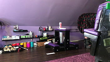 Dominatrix waxing man;s legs