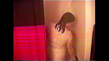 Busty brunette gets soaked in the shower