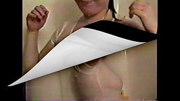 Busty brunette gets soaked in the shower