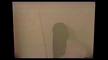 Busty brunette gets soaked in the shower