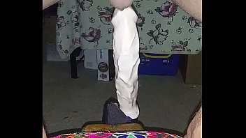 Riding a huge dildo