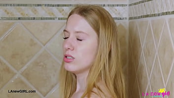 Blonde babe in bloom enjoys a sensual bath