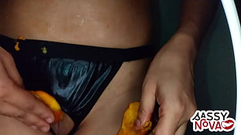 Sexy girl playing with mango