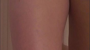 Julia shows off her assets by the door