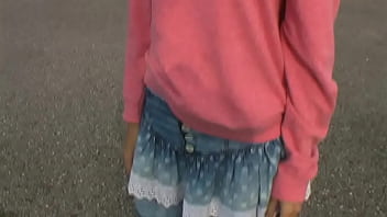 Bimba siting barefoot in her volkswagen car revving the engine