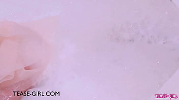 Stunning teen model enjoys a sensual bath