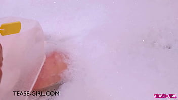 Stunning teen model enjoys a sensual bath