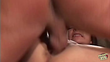 A brunette woman exposes her breasts before consenting to have her buttocks vigorously penetrated on video