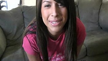 Busty latina toys her shaved pussy in a couch