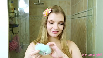 Fresh and radiant face blonde model enjoys a sensual bath