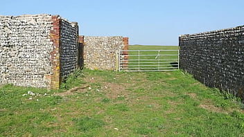 Voyeur watches girl next door as she masturbates outside a public barn in the sun