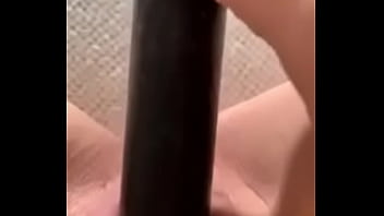 Mature slut masturbates with curling iron