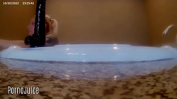 Petite blonde plays with huge bbc toy in the bath