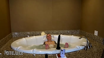 Petite blonde plays with huge bbc toy in the bath