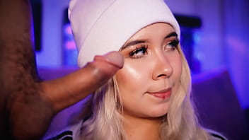 Blonde with a pretty face makes a living sucking cocks on the internet