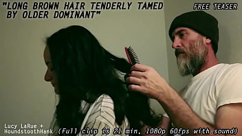 Long brown hair tenderly tamed by older dominant
