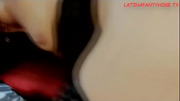 Mandy masturbates on her couch wearing stockings and stiletto high heels