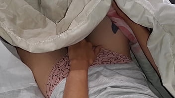 Our risky masturbation under the blanket next to my stepmother