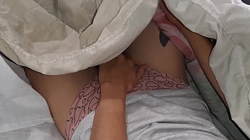 Our risky masturbation under the blanket next to my stepmother