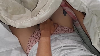 Our risky masturbation under the blanket next to my stepmother