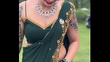 Indian sleevless saree model with tatoo on full body Indian sleevless saree model with tatoo on full body