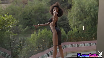 Glamorous busty black babe presenting a sensual striptease