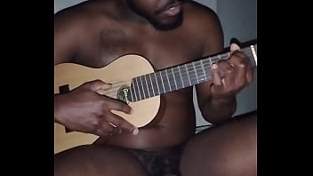 Translating other meanings of horns in the air while singing and playing guitar naked