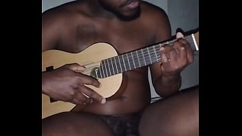 Translating other meanings of horns in the air while singing and playing guitar naked