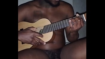 Translating other meanings of horns in the air while singing and playing guitar naked