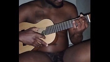 Translating other meanings of horns in the air while singing and playing guitar naked