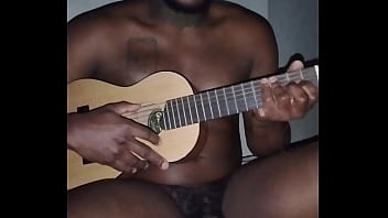 Translating other meanings of horns in the air while singing and playing guitar naked