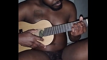 Translating other meanings of horns in the air while singing and playing guitar naked Translating other meanings of horns in the air while singing and playing guitar naked