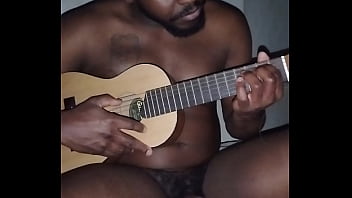 Translating other meanings of horns in the air while singing and playing guitar naked