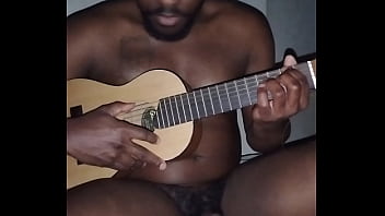 Translating other meanings of horns in the air while singing and playing guitar naked