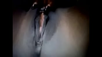 Black bitch stroking pussy