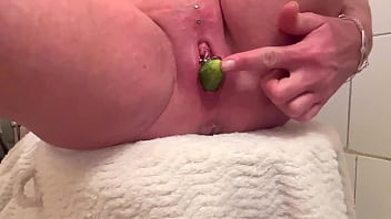 Two cucumber in pussy and pushout during pee