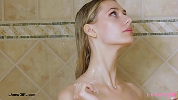 Aspiring blonde model enjoys a sensual bath