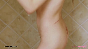 Aspiring blonde model enjoys a sensual bath