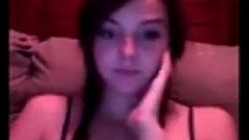 Pretty young girl rubs her pussy