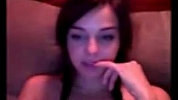 Pretty young girl rubs her pussy