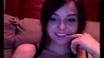 Pretty young girl rubs her pussy