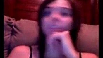 Pretty young girl rubs her pussy