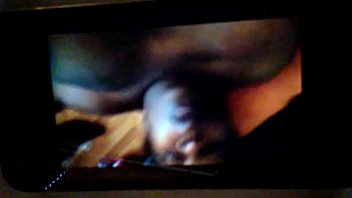 On the floor on her air mattress