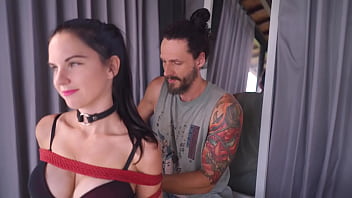 Two girls tied up and giving head