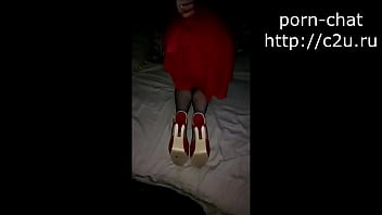 A girl in a chic dress shows her charms