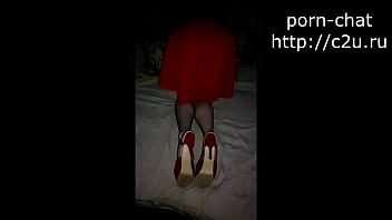 A girl in a chic dress shows her charms