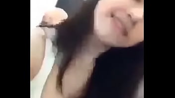 Girl showing her medium size melons