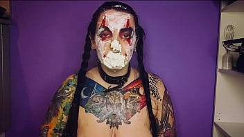 Sexy horny clown girl with a perfect ass has naughty fun with whipped cream at her kitchen