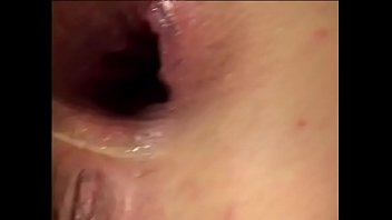 Sexy brunette in a short jean skirt sucks a dick and gets sprayed in the face